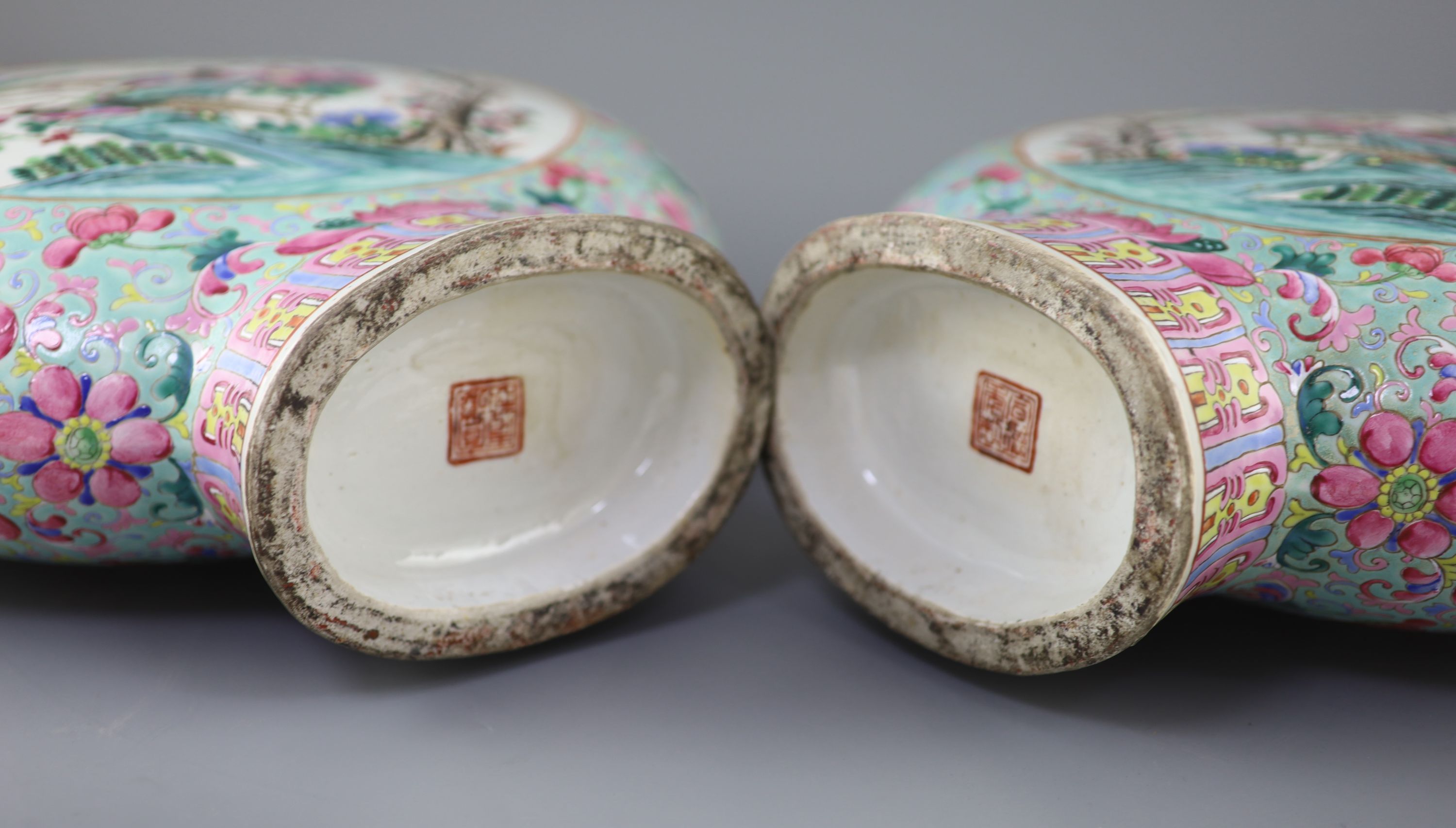 A pair of large Chinese turquoise ground famille rose moon flasks, Tongzhi seal mark and of the period (1862-74), 51cm high, Provenance